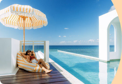 Woman relaxing next a pool on holidays