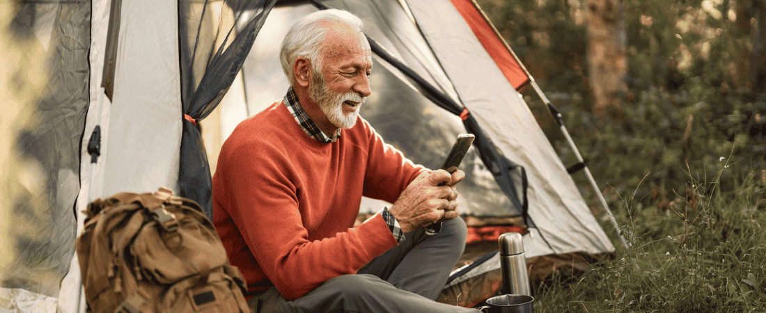 Older traveller using our Cover-More app during their trip