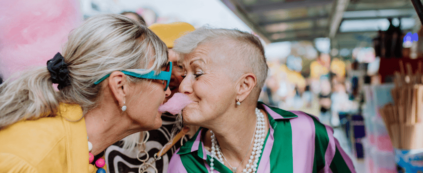 LGBTQIA+ couple sharing fairy floss