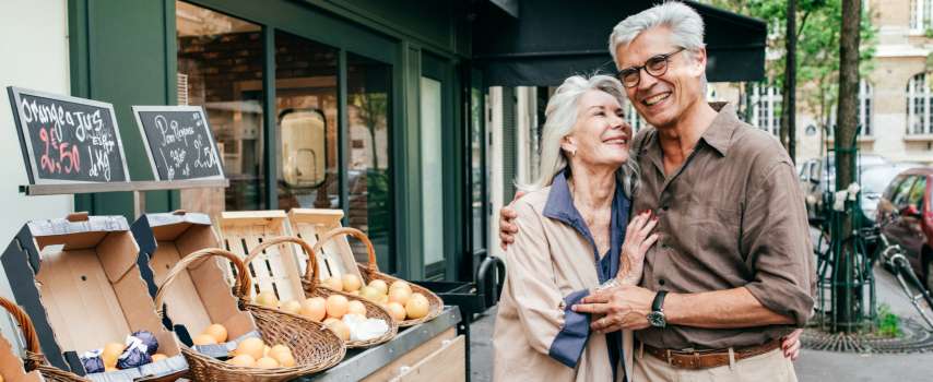 Older couple, who purchased travel insurance for France, exploring Paris  