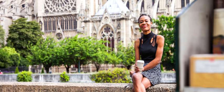 Traveller who purchased travel insurance for France enjoying some coffee in Paris