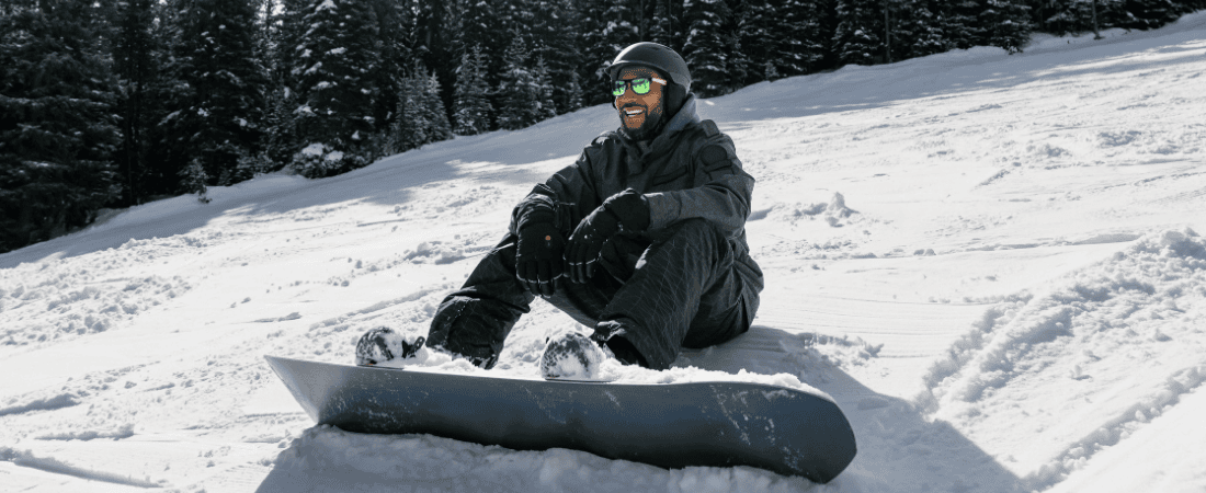 First-time snowboarder taking a break