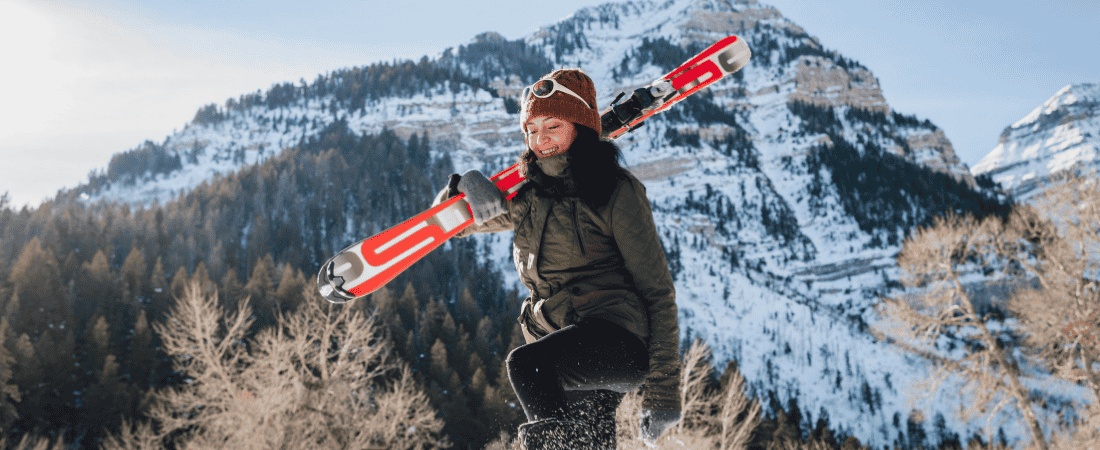 Skiier keeping her ski gear with her on the slopes